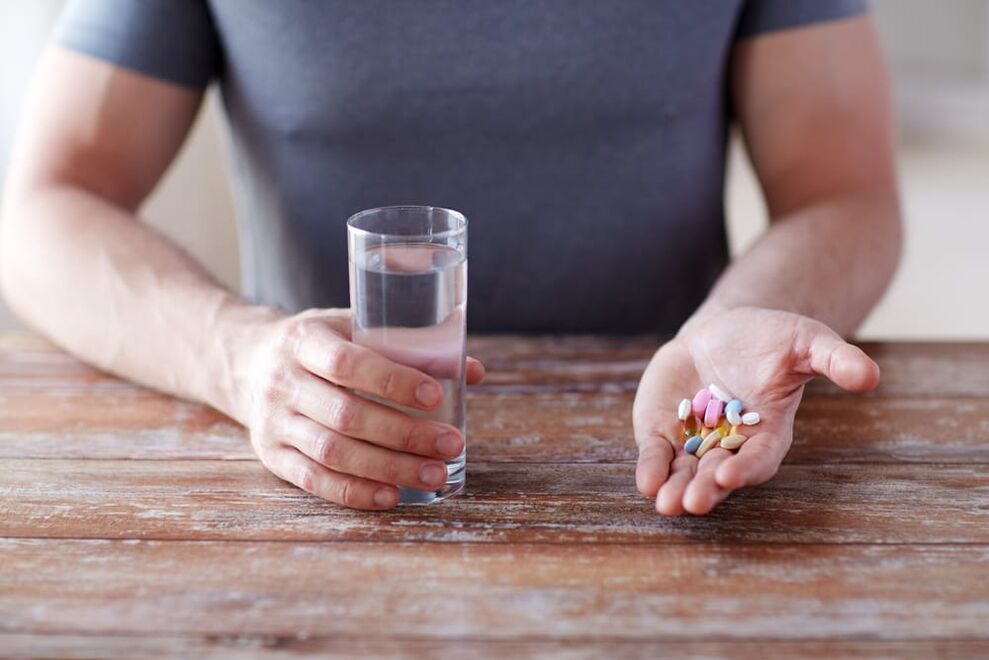 a man taking vitamins for photo potency 1